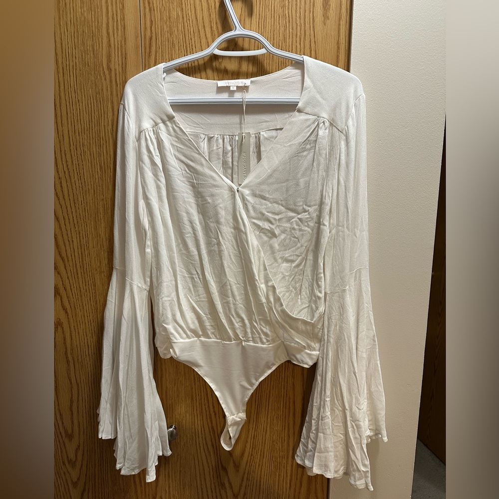 Olivaceous. Soft white dressy bodysuit.